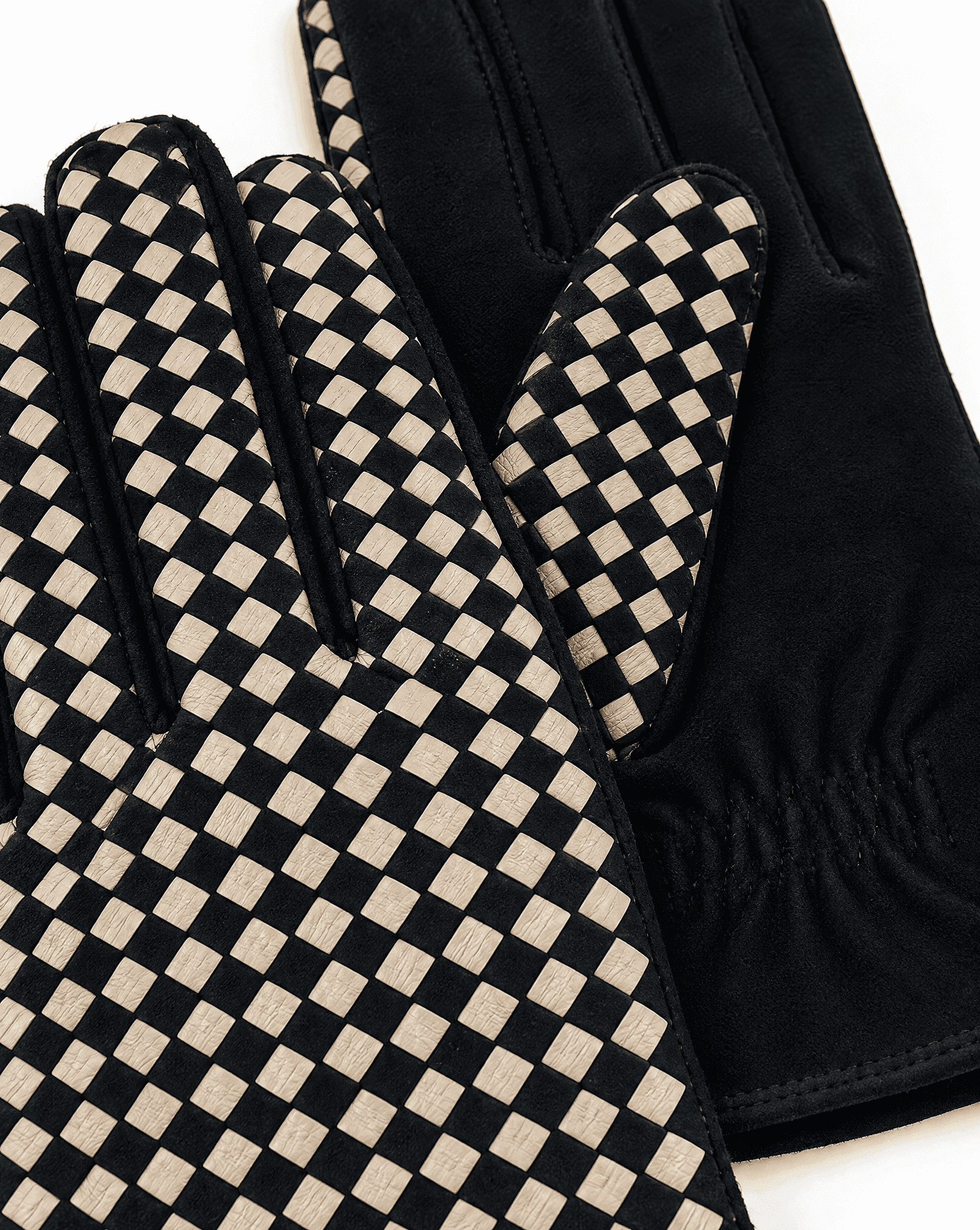 black suede gloves with a cream checkerboard back, detail
