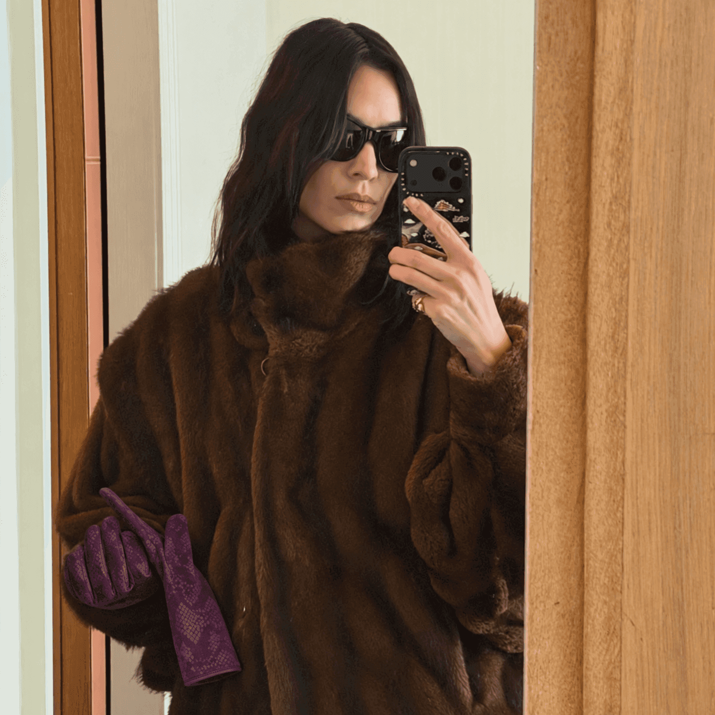 plum suede gloves with a python print, worn