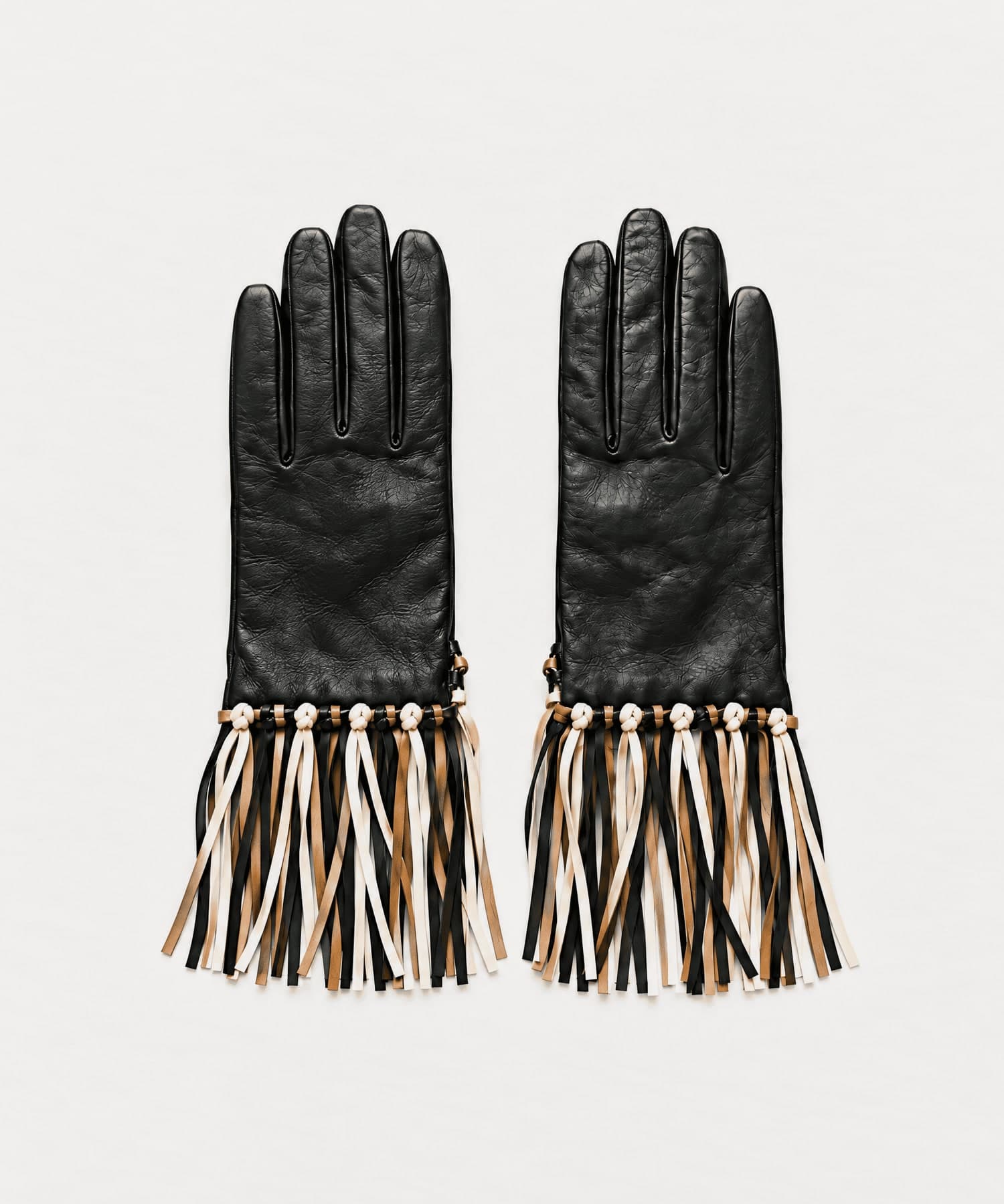 black nappa leather gloves with a black, tan and cream fringe, front